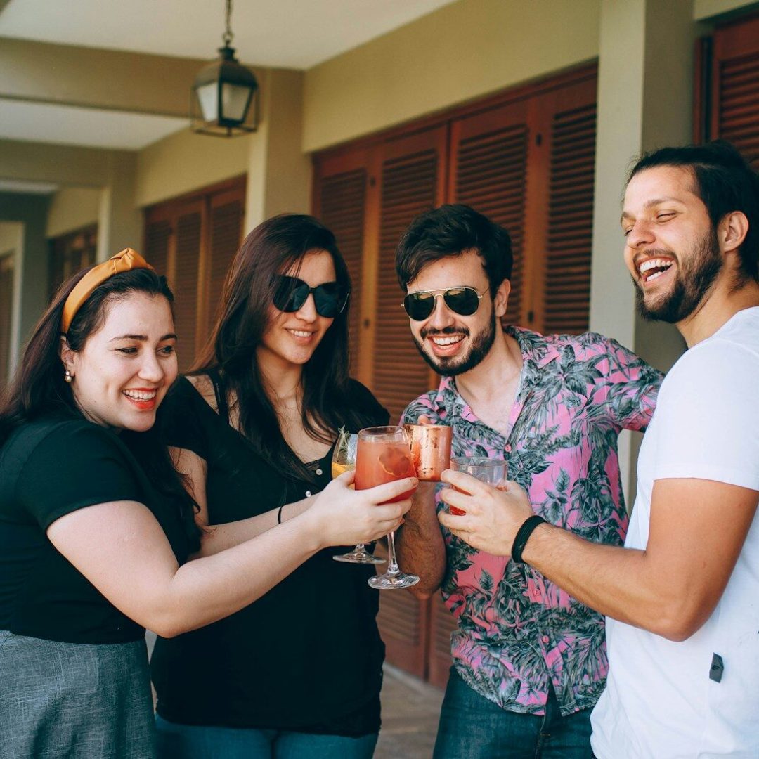 3 women and man smiling